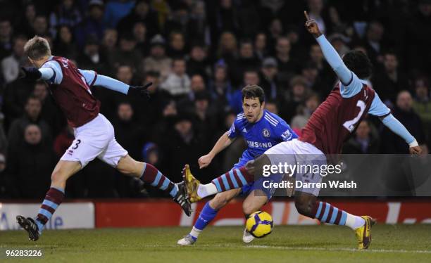 Joe Cole of Chelsea looks for a way past Andre Bikey and Christian Kalvenes of Burnley during the Barclays Premier League match between Burnley and...