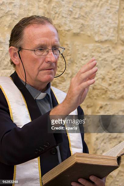priest with bible - anglikan bildbanksfoton och bilder