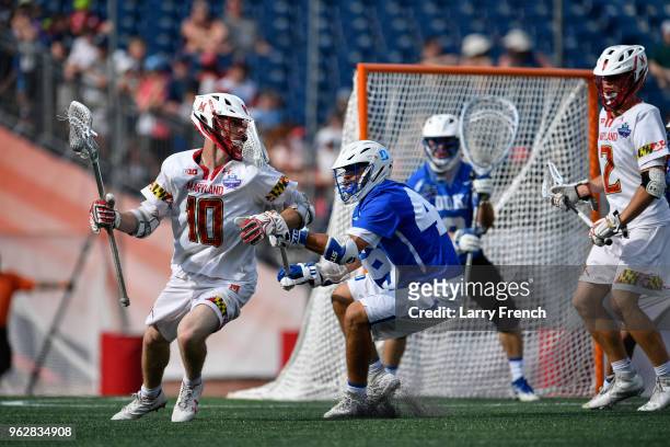 University of Maryland middle Jared Bernhardt looks for a way around Duke University defender Kevin McDonough during the teams' NCAA Photos via Getty...