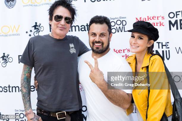 Tommy Lee, Off the Menu Founder & CEO Lawrence Longo and Tommy Lee's Fiance Brittany Furlan attend the Los Angeles Times Food Bowl Secret Burger...