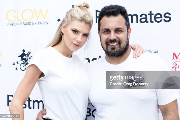 Model Charlotte Mckinney and Off the Menu Founder & CEO Lawrence Longo attend the Los Angeles Times Food Bowl - Secret Burger Showdown at Wallis...