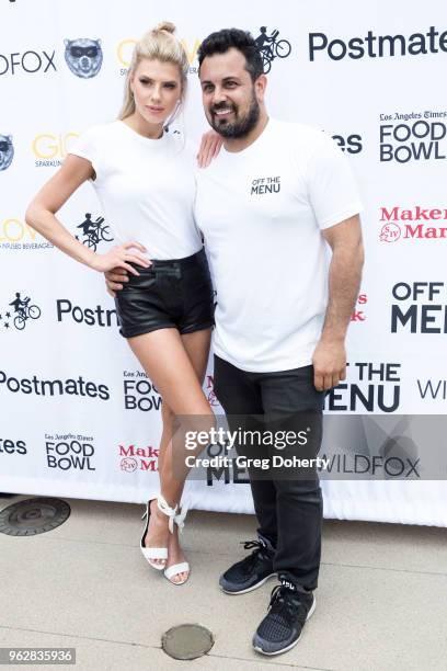 Model Charlotte Mckinney and Off the Menu Founder & CEO Lawrence Longo attend the Los Angeles Times Food Bowl - Secret Burger Showdown at Wallis...