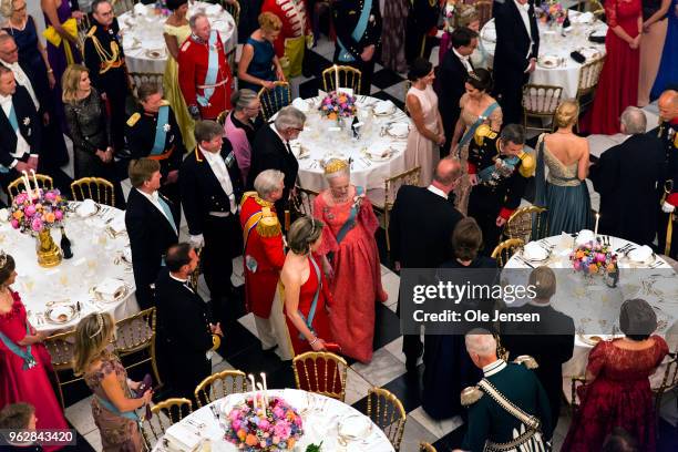 Queen Margrethe of Denmark is lead to her table at The Knights hall where she hoost the Galla Dinner for Crown Prince Frederik on the occasion of his...