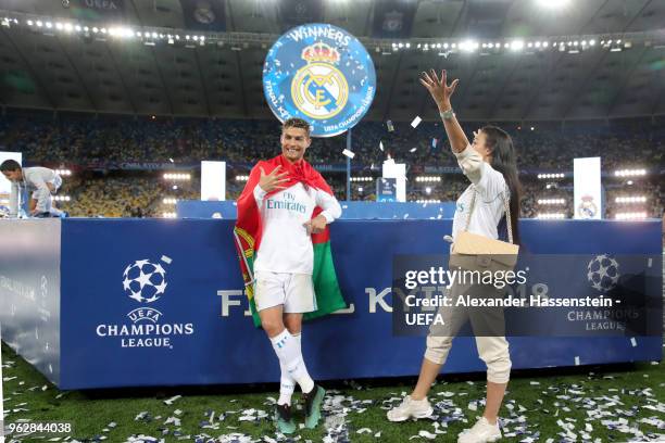 Cristiano Ronaldo of Real Madrid celebrates with Georgina Rodriguez following his sides victory in the UEFA Champions League Final between Real...