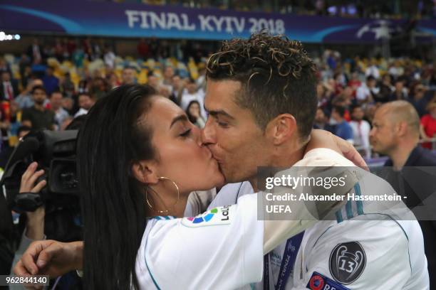 Cristiano Ronaldo of Real Madrid celebrates with Georgina Rodriguez following his sides victory in the UEFA Champions League Final between Real...