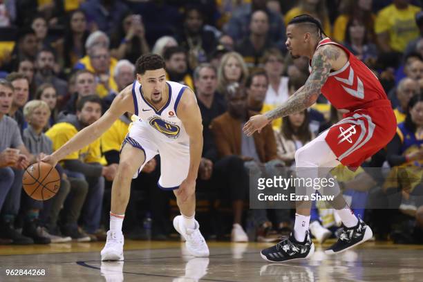 Klay Thompson of the Golden State Warriors controls the ball against Gerald Green of the Houston Rockets during Game Six of the Western Conference...