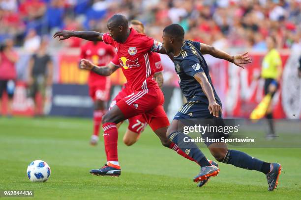 New York Red Bulls forward Bradley Wright-Phillips battles Philadelphia Union defender Mark McKenzie during the first half of the Major League Soccer...