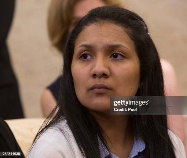 Thamy Holt, the spouse of Joshua Holt listens during a meeting with United States President Donald Trump at The White House on May 26, 2018 in...