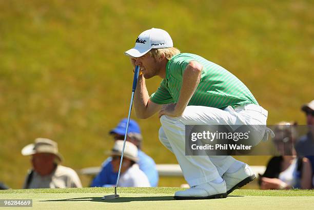 Andrew Dodt of Australia lines up his putt on the 1st green during day four of the New Zealand Open at The Hills Golf Club on January 31, 2010 in...