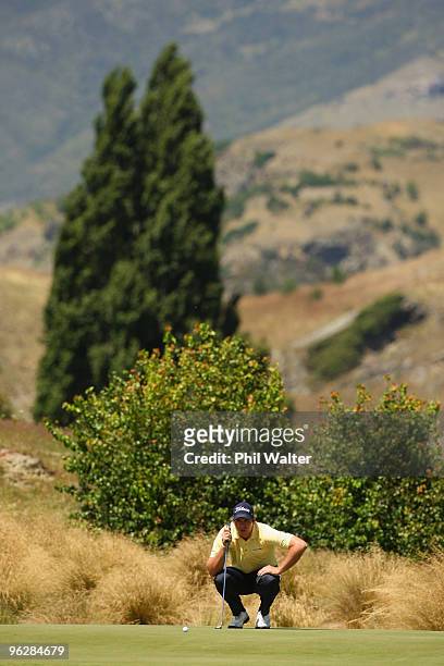 Robert Gates of the USA lines up his putt on the 2nd green during day four of the New Zealand Open at The Hills Golf Club on January 31, 2010 in...