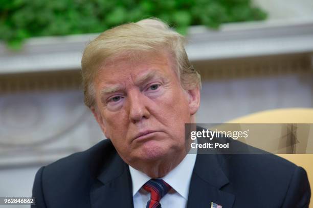 President Donald Trump listens during a meeting with Joshua Holt, members of Holt's family and the congressional delegation of Utah at the U.S. At...