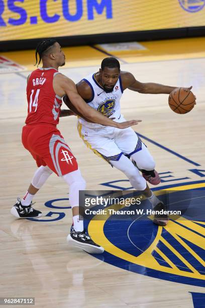 Kevin Durant of the Golden State Warriors drives with the ball against Gerald Green of the Houston Rockets during Game Six of the Western Conference...