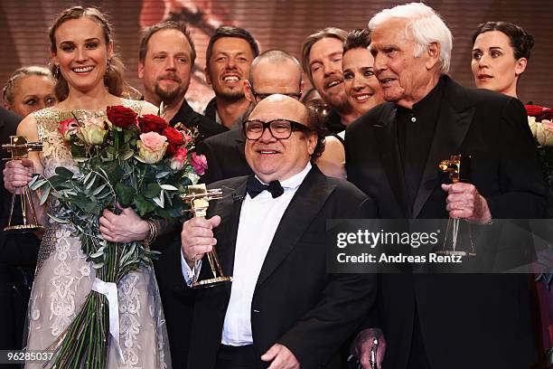 Actors Diane Kruger, Danny Devito and Joachim Fuchsberger pose with their awards during the Goldene Kamera 2010 Award at the Axel Springer Verlag on...