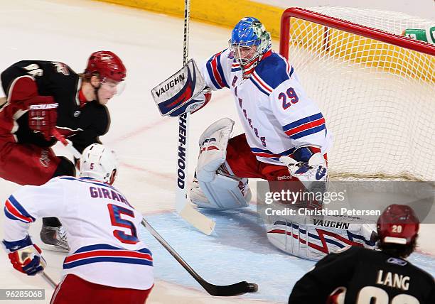 Goaltender Chad Johnson of the New York Rangers is unable to stop a goal from Mikkel Boedker of the Phoenix Coyotes during the first period of the...