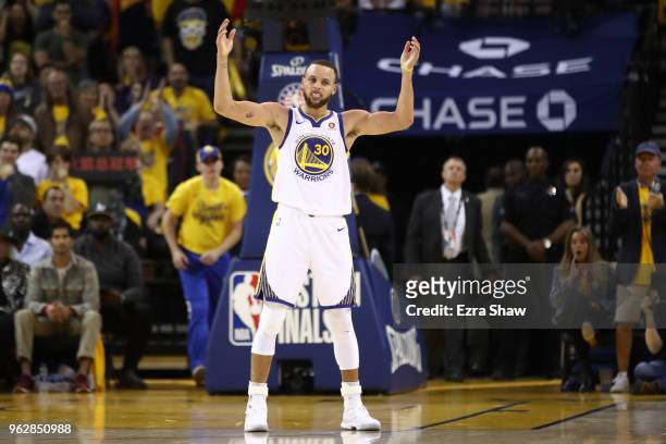 Stephen Curry of the Golden State Warriors reacts after a play against the Houston Rockets during Game Six of the Western Conference Finals in the...