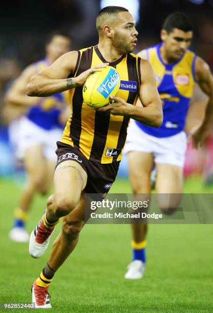 Jarman Impey of the Hawks runs with the ball during the round 10 AFL match between the Hawthorn Hawks and the West Coast Eagles at Etihad Stadium on...