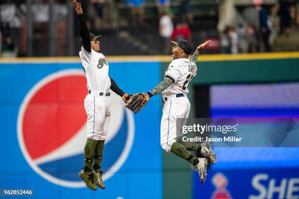 Francisco Lindor celebrates with Rajai Davis of the Cleveland Indians after the Indians defeated the Houston Astros at Progressive Field on May 26,...