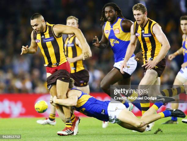 Jarman Impey of the Hawks gets tackled during the round 10 AFL match between the Hawthorn Hawks and the West Coast Eagles at Etihad Stadium on May...