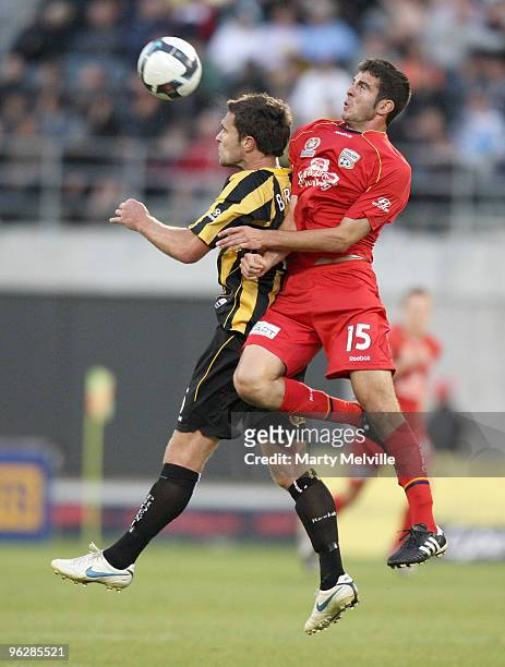Tim Brown of the Phoenix gets tackled by Francesco Monterosso of Adelaide during the round 25 A-League match between Wellington Phoenix and Adelaide...