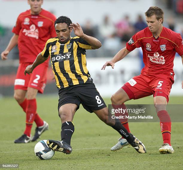 Paul Ifill of the Phoenix gets tackled by Daniel Mullen of Adelaide during the round 25 A-League match between Wellington Phoenix and Adelaide United...