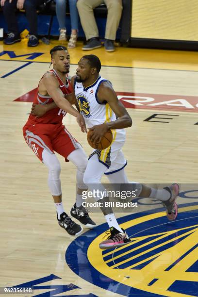 Kevin Durant of the Golden State Warriors handles the ball against Gerald Green of the Houston Rockets in Game Six of the Western Conference Finals...