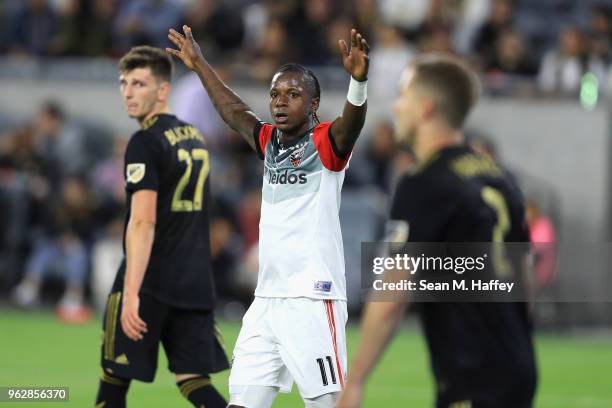 Darren Mattocks of D.C. United reacts to a missed shot on goal as Tristian Blackmon and Jordan Harvey of Los Angeles FC look on during the second...