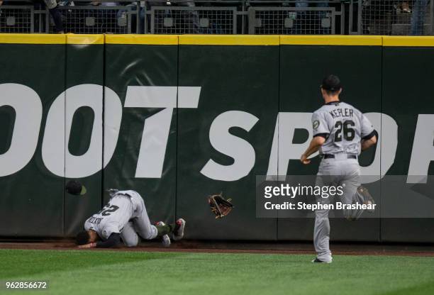 Centerfielder Byron Buxton of the Minnesota Twins hits the warning track after trying to catch a two-run home run ball hit by Nelson Cruz of the...