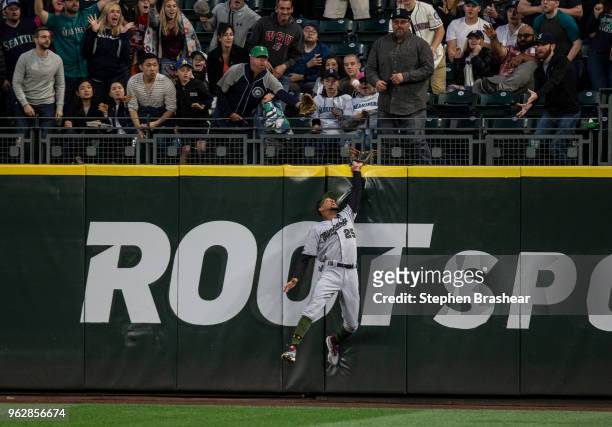Centerfielder Byron Buxton of the Minnesota Twins leaps into the outfield wall to try to get get to a two-run home run hit by Nelson Cruz of the...