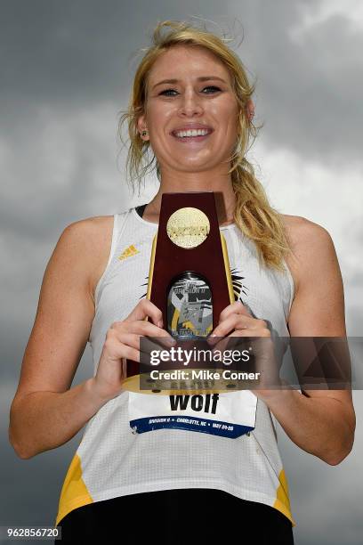 Madison Wolf of Fort Hays State University poses with the champion's trophy after her win in the Women's Javelin Throw during the Division II Men's...