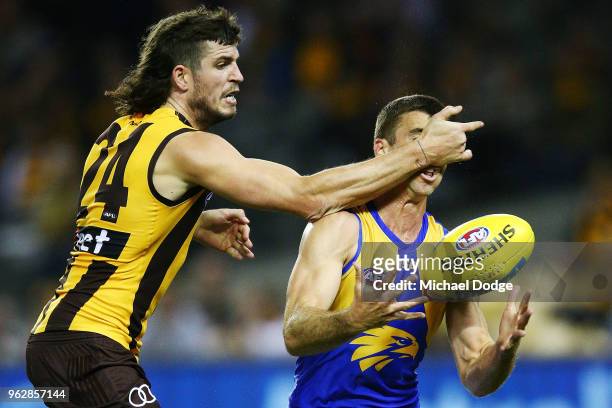 Ben Stratton of the Hawks collects high Jamie Cripps of the Eagles during the round 10 AFL match between the Hawthorn Hawks and the West Coast Eagles...