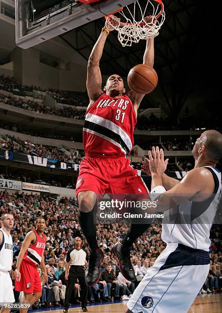 Jeff Pendergraph of the Portland Trailblazers dunks against Jason Kidd of the Dallas Mavericks during a game at the American Airlines Center on...