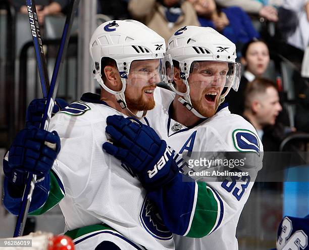 Henrik Sedin and Daniel Sedin the Vancouver Canucks celebrate goal during game action against the Toronto Maple Leafs January 30, 2010 at the Air...