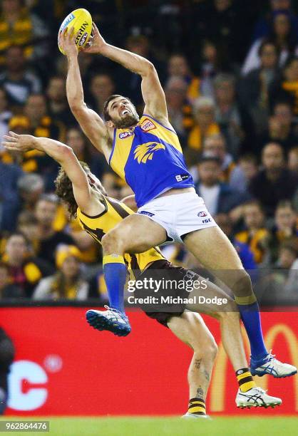 Jack Darling of the Eagles marks the ball against Ben Stratton of the Hawks during the round 10 AFL match between the Hawthorn Hawks and the West...