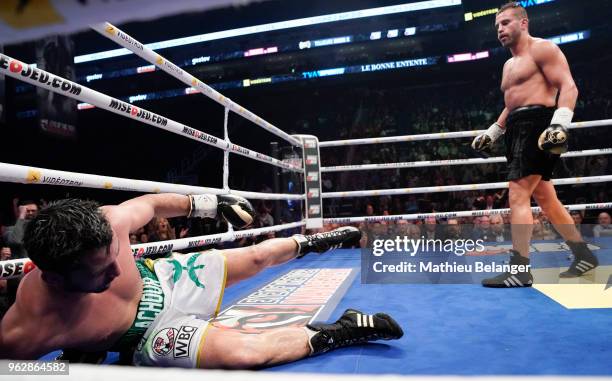 Karim Achour of France falls after being punched by David Lemieux of Canada during their middleweight fight at the Videotron Center on May 26, 2018...
