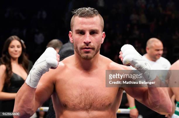 David Lemieux of Canada celebrates his victory against Karim Achour of France during their middleweight fight at the Videotron Center on May 26, 2018...