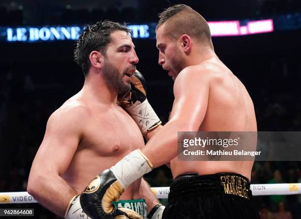 David Lemieux of Canada is congratulated by Karim Achour of France during their middleweight fight at the Videotron Center on May 26, 2018 in Quebec...