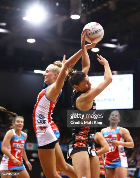 Madi Robinson of the Magpies is challenged by Maddy Turner of the Swifts during the round five Super Netball match between the Swifts and the Magpies...