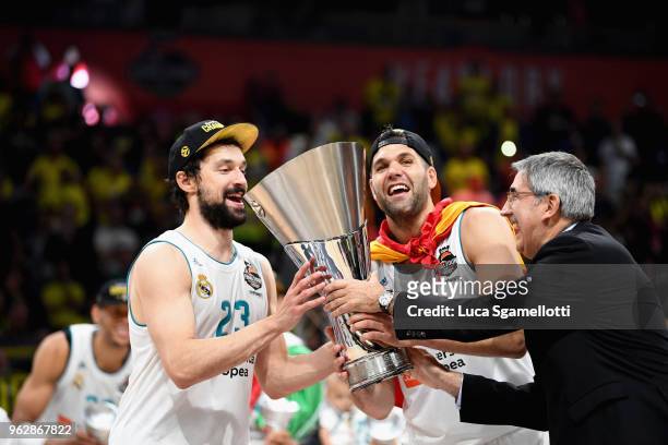 Jordi Bertomeu, CEO and President of Euroleague Basketball, delivery the Trophy to Felipe Reyes, #9 and Sergio Llull, #23 of Real Madrid at the end...