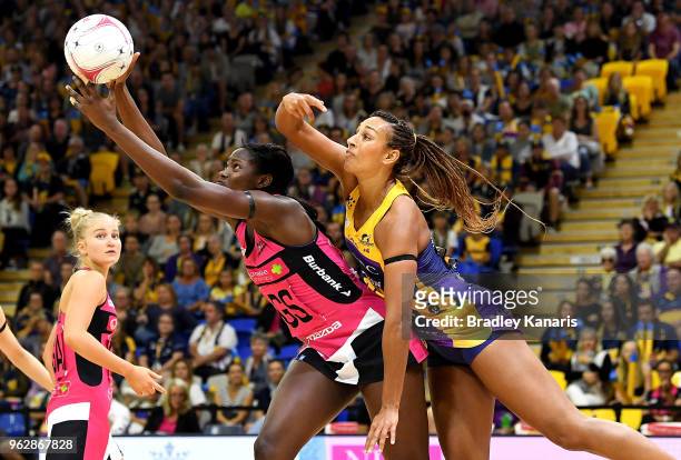 Shimona Nelson of the Thunderbirds and Geva Mentor of the Lightning challenge for the ball during the round five Super Netball match between the...