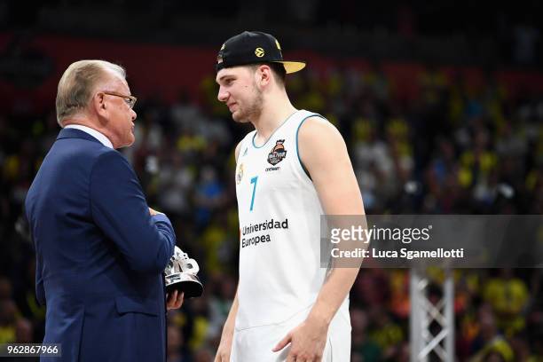 Luka Doncic, #7 of Real Madrid receive the MVP Trophy from Dusan Ivkovic at the end of 2018 Turkish Airlines EuroLeague F4 Championship Game between...