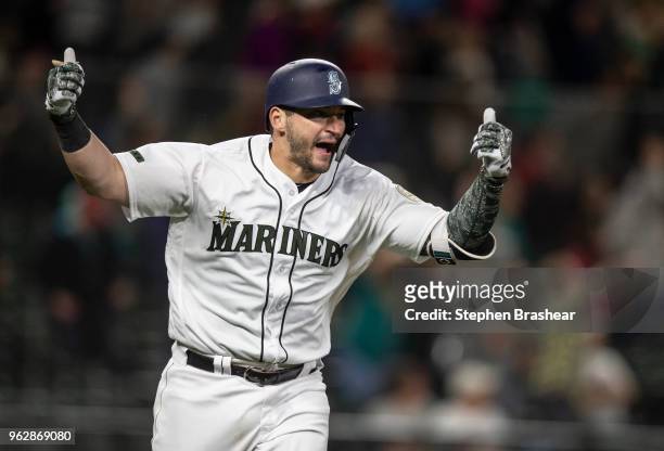 Mike Zunino of the Seattle Mariners reacts after hitting a walk off solo home run off of relief pitcher Matt Magill of the Minnesota Twins during the...