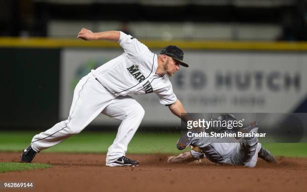 Third baseman Kyle Seager of the Seattle Mariners tags out a stealing Gregorio Petit of the Minnesota Twins during the eleventh inning of game at...