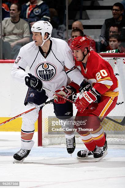 Curtis Glencross of the Calgary Flames skates against Jason Strudwick of the Edmonton Oilers on January 30, 2010 at Pengrowth Saddledome in Calgary,...