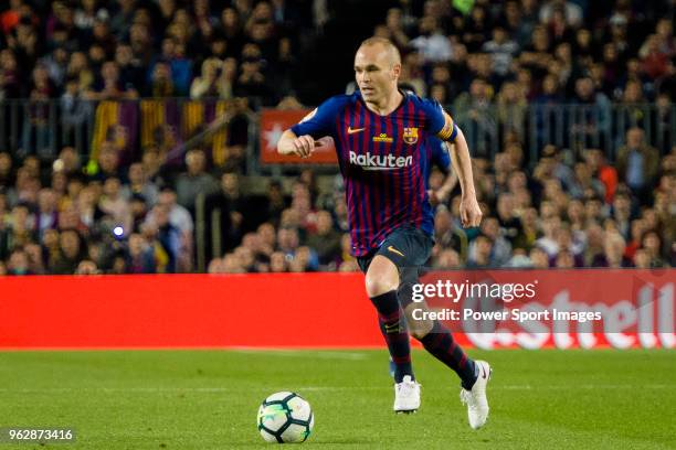 Andres Iniesta of FC Barcelona runs with the ball during the La Liga match between Barcelona and Real Sociedad at Camp Nou on May 20, 2018 in...