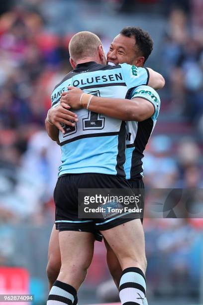 Luke Lewis of the Sharks celebrates a try with a team mate during the round 12 NRL match between the Newcastle Knights and the Cronulla Sharks at...