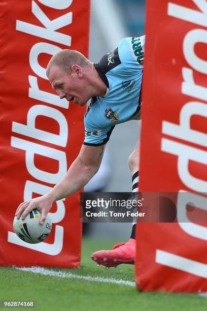 Luke Lewis of the Sharks scores a try during the round 12 NRL match between the Newcastle Knights and the Cronulla Sharks at McDonald Jones Stadium...