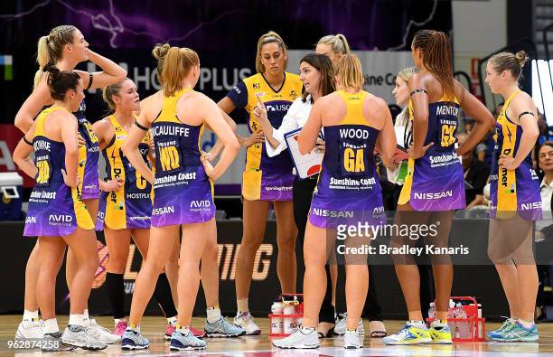 Coach Kyee Byrne of the Lightning talks to her players at the halftime break during the round five Super Netball match between the Lightning and the...