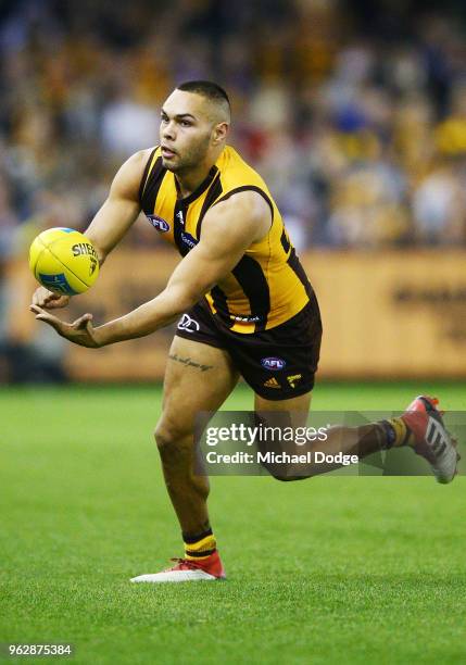 Jarman Impey of the Hawks handballs during the round 10 AFL match between the Hawthorn Hawks and the West Coast Eagles at Etihad Stadium on May 27,...