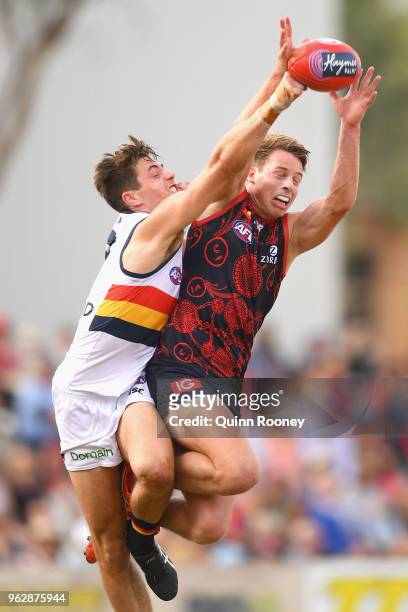 Mitch Hannan of the Demons marks infront of Jake Kelly of the Crows during the round 10 AFL match between the Melbourne Demons and the Adelaide Crows...