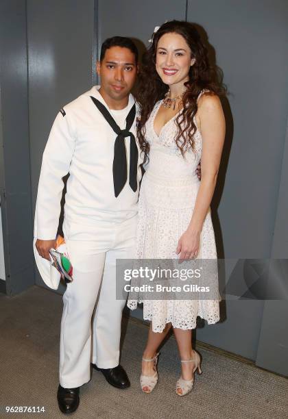 Members of the United States Military pose with Alison Luff of the cast of the Jimmy Buffett Broadway Musical "Escape to Margaritaville" backstage to...